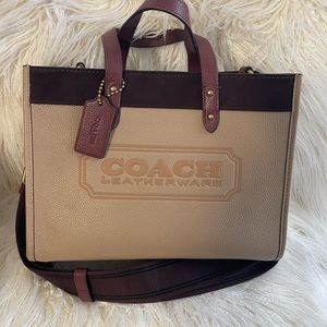 Coach Field Tote 30 In Colorblock with Coach Badge. Tan bag with burgundy trim.